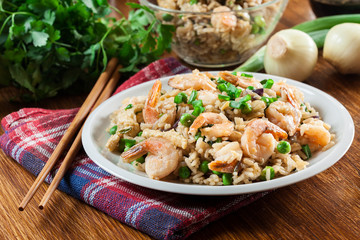 Fried rice with shrimp and vegetables served on a plate