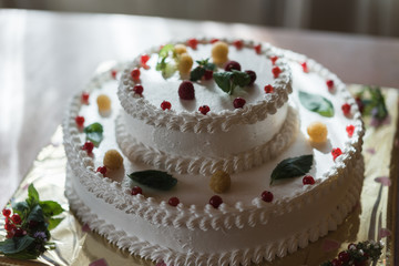 Strawberry cake on a wooden background.
