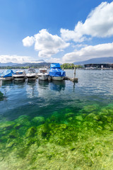Fototapeta na wymiar Yacht on a mountain lake in the Swiss Alps
