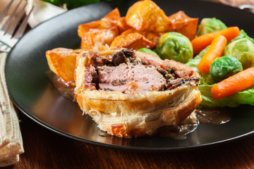 Pork tenderloin in wellington style in puff pastry