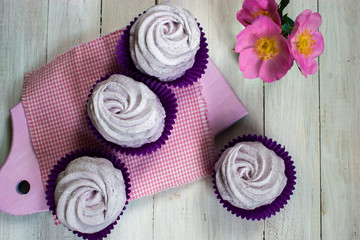 Lavender marshmallow.Homemade marshmallows on a light background. Purple marshmallows on the board. Home blue marshmallow.
