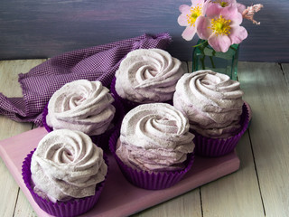 Lavender marshmallow.Homemade marshmallows on a light background. Purple marshmallows on the board. Home blue marshmallow.