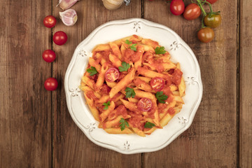 Penne pasta photo with tomato sauce and place for text