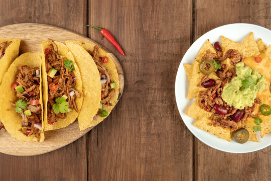 Mexican food with copy space, overhead photo of hot spicy tacos and nachos