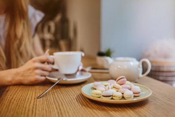 Girl drinking tea in the cafe.