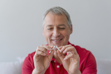 Quit smoking - male hand crushing cigarette
