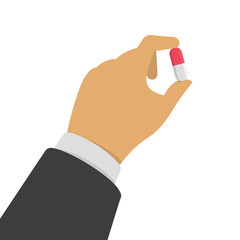 Hhand holding pill.