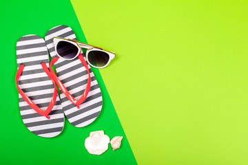 Beach flip flop on color background