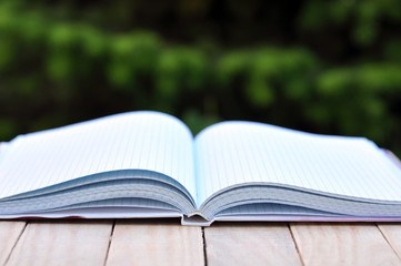book with white empty pages on the table outdoor