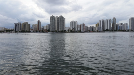 Fototapeta na wymiar City with buildings and beach at the same time, Guaruja city, South America, Brazil