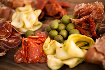 fast food and unhealthy eating concept - close up of fast food snacks and pizza on wooden table