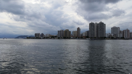 Fototapeta premium City with buildings and beach at the same time, Guaruja city, South America, Brazil