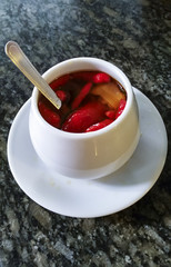 Red chilli pepper in a white pot