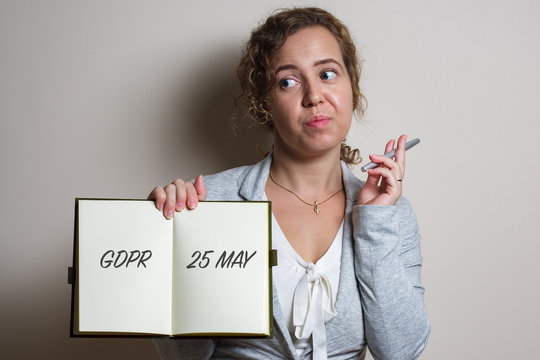 Nervous business woman handle note with GDPR (General Data Protection Regulation) act title