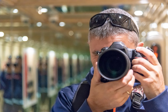 Multiple images of photographer shooting mirror