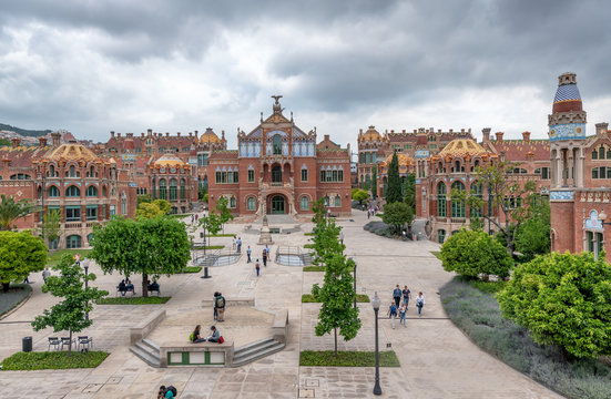 BARCELONA, SPAIN - MAY 12, 2018: People visit Recinte Modernista de Sant Pau. The city attracts 10 million tourists annually