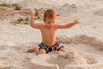 Child destroy sand castle.