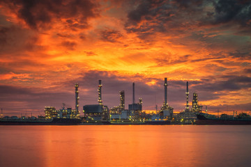 Oil refinery plant and prtroleum industry with morning sunrise