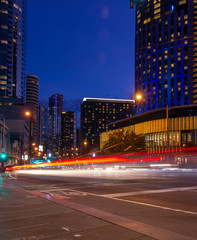Fototapeta na wymiar Light trails of cars on street in the city at night time.Melbourne,Australia 09/08/2018