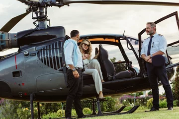 Fototapeten Couple traveling by a private helicopter © Jacob Lund