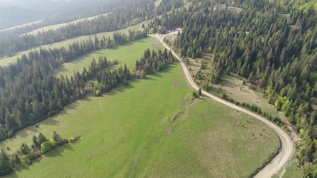 Flying over the beautiful Ukrainian Carpathians mountain and coniferous forest. Aerial camera shot. Landscape panorama. Ukraine
