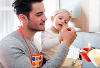 Father and daughter enjoying time together in the kitchen, family lifestyle