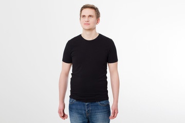 Fototapeta premium Young man wearing blank t-shirt isolated on white background. Copy space. Place for advertisement. Front shirt view. Summer clothes