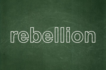 Obraz premium Political concept: text Rebellion on Green chalkboard background