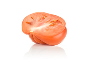 One beef tomato half isolated on white background big ripe red ribbing.