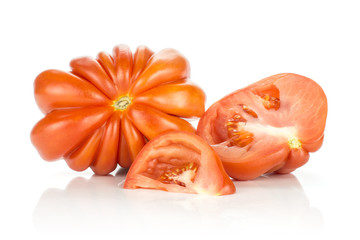 Sliced beef tomatoes collection (one whole flower shape section half and a slice) isolated on white background big ripe red flesh with seeds.