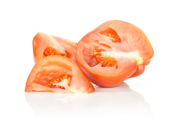 Sliced beef tomato (one section half two cut pieces) isolated on white background big ripe red flesh with seeds.