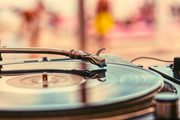 Record and turntable close-up on blurred background