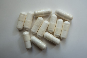 Top view of white capsules of magnesium citrate