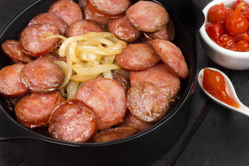 Sliced and fried Calabrese sausage seen from above 