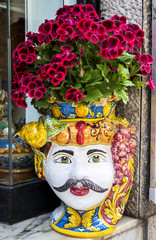 flower vase shaped like a Moorish head, the typical ceramics make a hand in a shop in Palermo, Sicily island