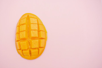 fresh ripe mango and copy space for text on pink background