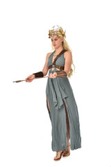 full length portrait of pretty blonde lady wearing fantasy toga gown,  and holding a bow and arrow. standing pose on white background.