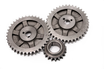 A gear wheel or pinion is a basic part of a gear train in the form of a disc with teeth on a cylindrical or conical surface meshing with the teeth of another gear