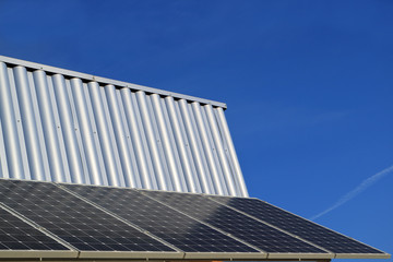 Fototapeta na wymiar Image of the solar battery on the wall against the sky.