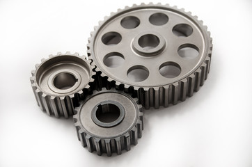 A gear wheel or pinion is a basic part of a gear train in the form of a disc with teeth on a cylindrical or conical surface meshing with the teeth of another gear