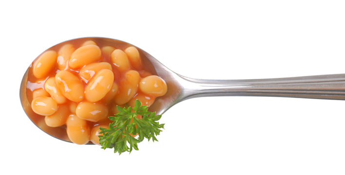 spoon of of beans in tomato sauce
