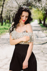 Beautiful Girl, brunette with red lips. Spring , shooting in the Park .