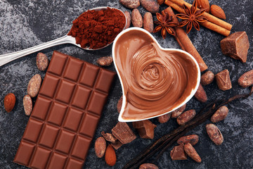 Chocolate bars on table with chocolate powder.