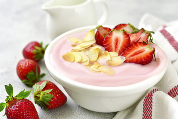 Natural strawberry yogurt with fresh berry.