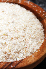 Portion of Psyllium Seeds on rustic dark background. Psyllium seed husks