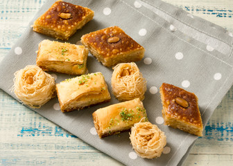 Oriental sweets on a wooden background.