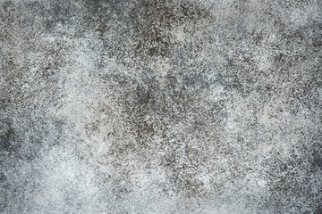 Dark grey stone or slate wall.
