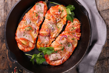 eggplant slice with ham and tomato