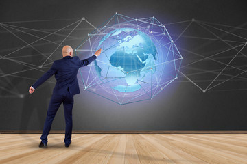 Businessman in front of a wall with a Connected network over a earth globe concept on a futuristic interface - 3d rendering