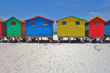 View of the brightly colored Victorian beach cabin houses on the Muizenberg Beach in Cape Town